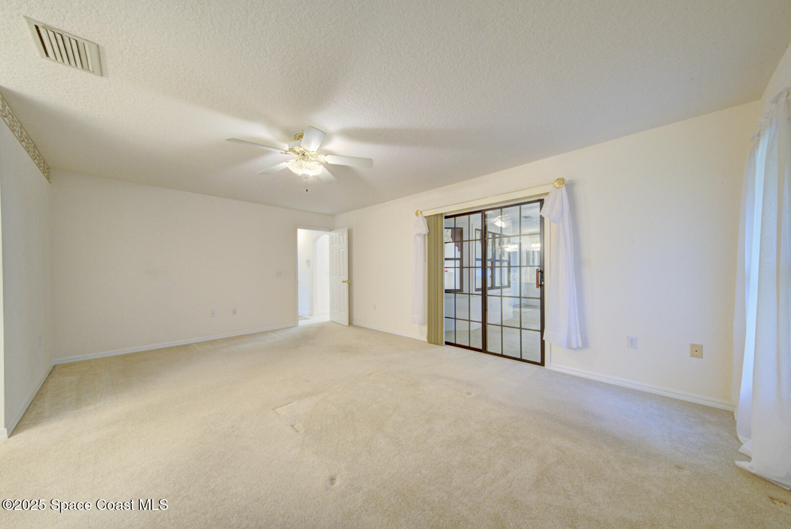 3105 Diamond Road Titusville, FL 32796 - Photo 23 of 81 master bedroom with slider to Florida ro