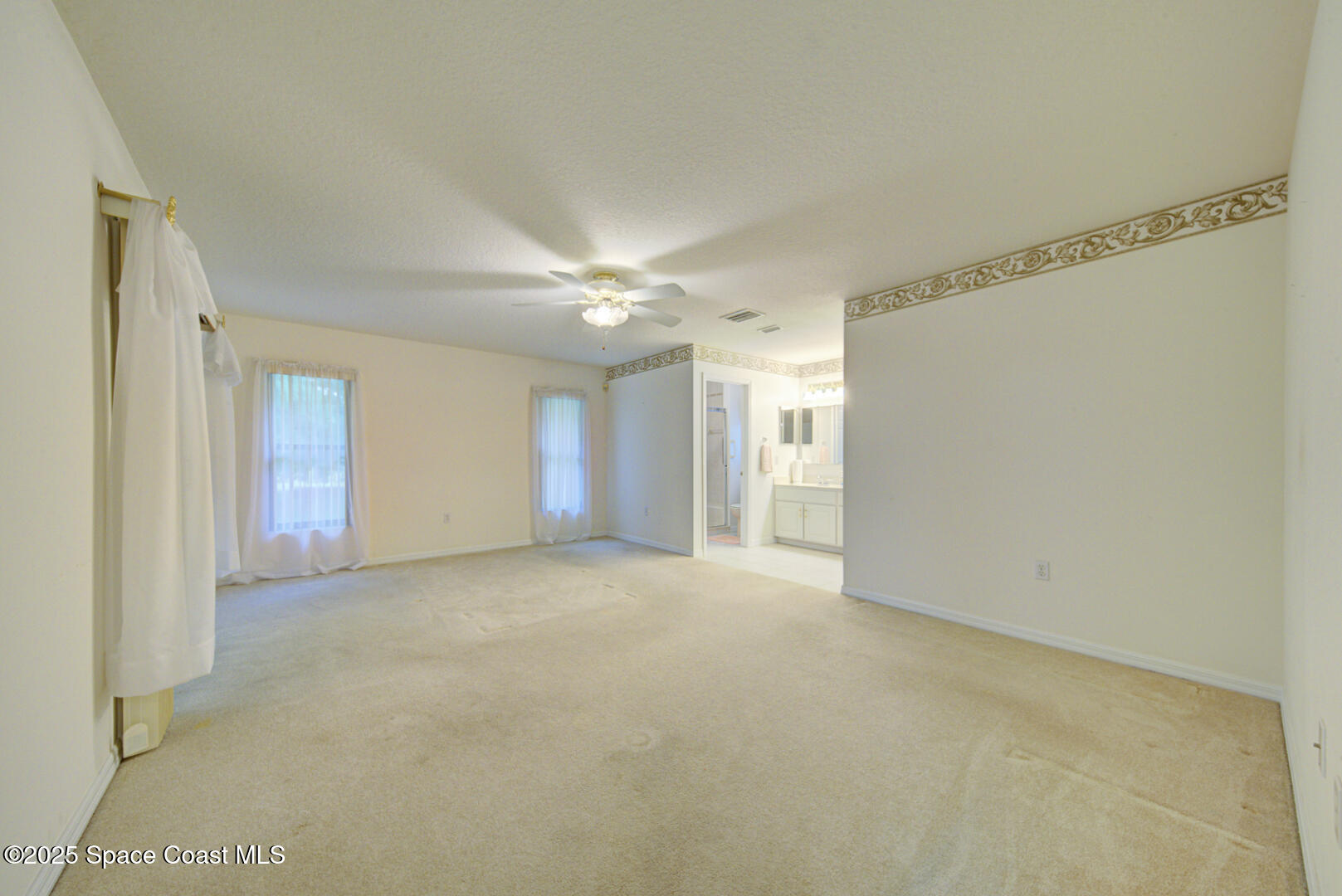 3105 Diamond Road Titusville, FL 32796 - Photo 24 of 81 a view of an empty room with a window
