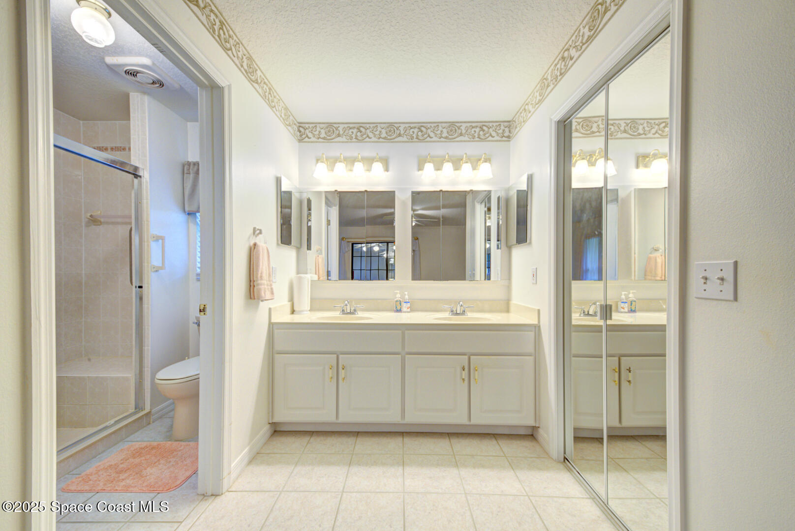 3105 Diamond Road Titusville, FL 32796 - Photo 25 of 81 a bathroom with a tub sink shower and mirror