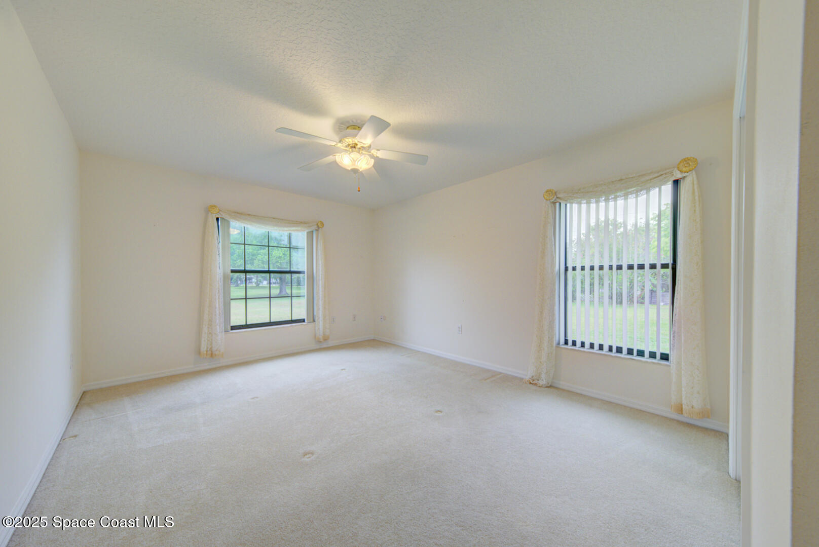 3105 Diamond Road Titusville, FL 32796 - Photo 43 of 81 an empty room with windows and closet