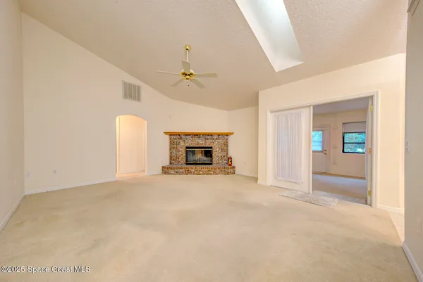 a view of walk in closet with wooden floor