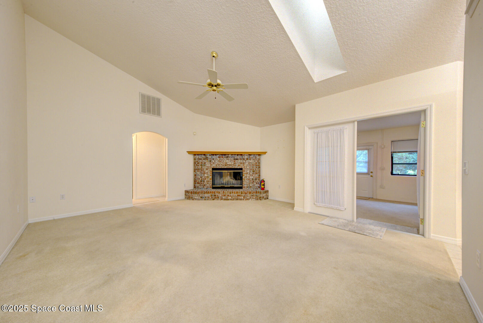 3105 Diamond Road Titusville, FL 32796 - Photo 47 of 81 a view of empty room with fireplace and fan