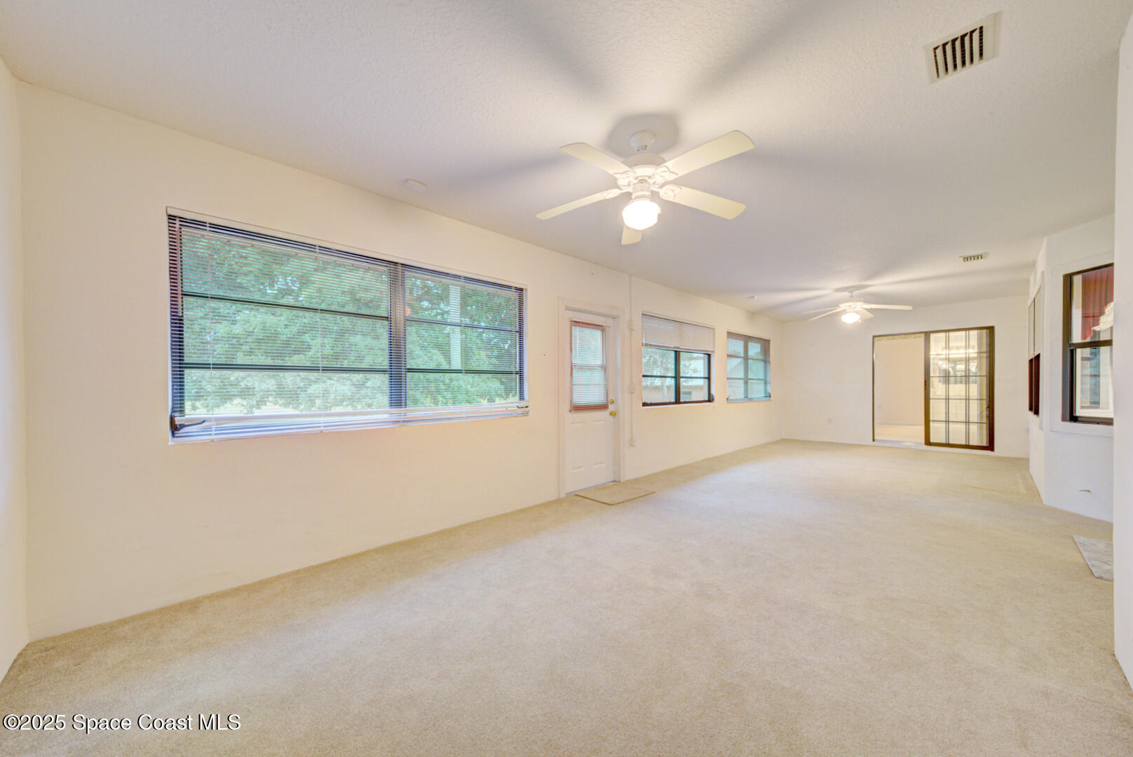 3105 Diamond Road Titusville, FL 32796 - Photo 48 of 81 a view of an empty room with a window