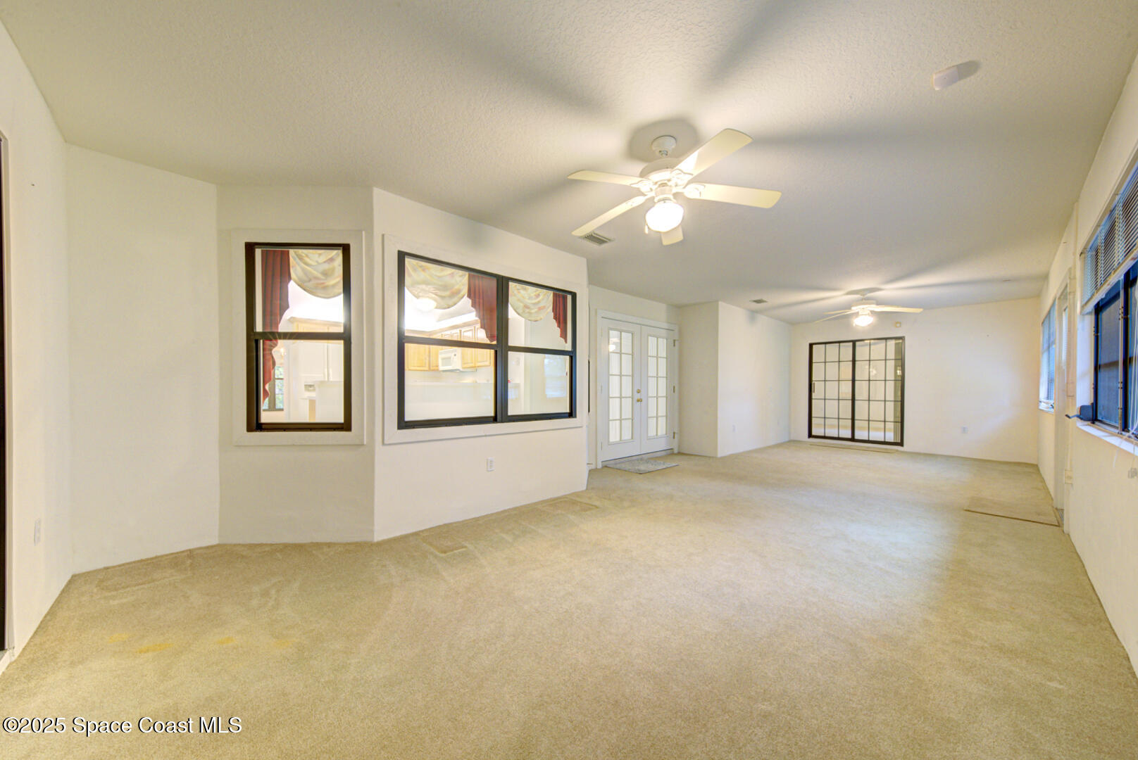 3105 Diamond Road Titusville, FL 32796 - Photo 49 of 81 a view of an empty room with a window