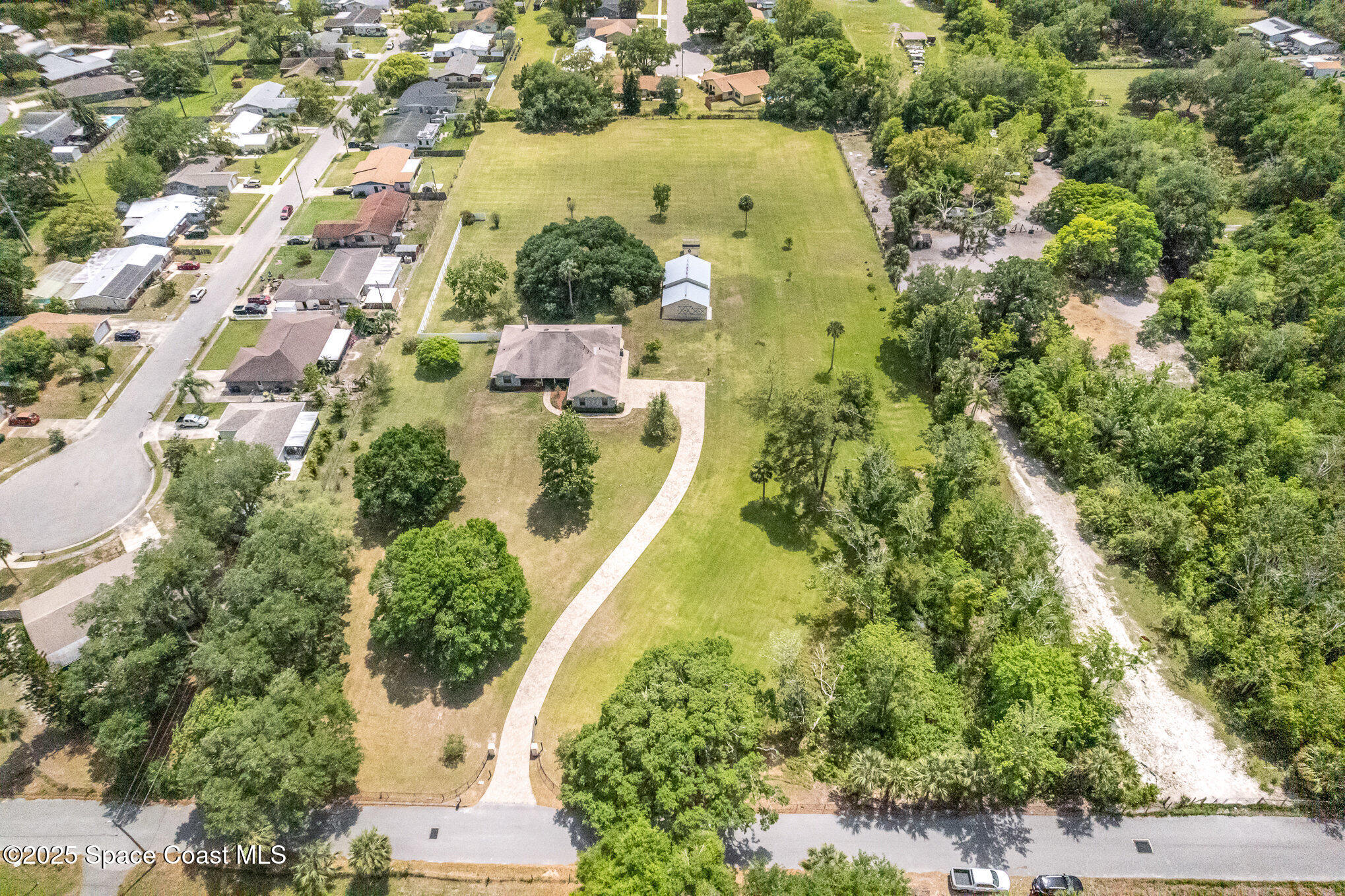3105 Diamond Road Titusville, FL 32796 - Photo 57 of 81 an aerial view of residential house with outdoor space and swimming pool