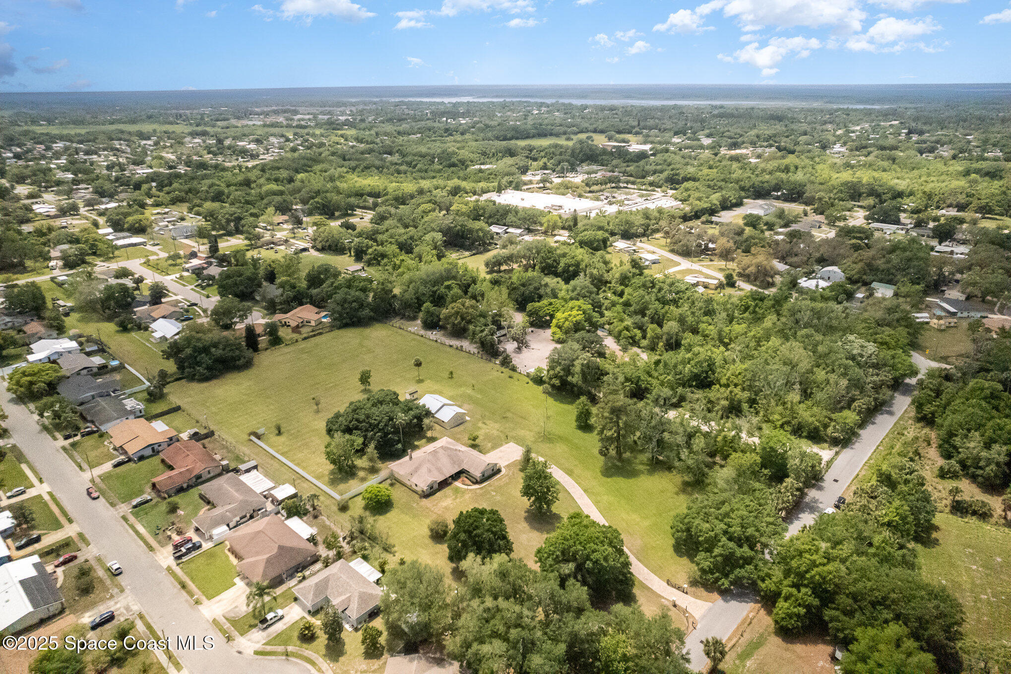 3105 Diamond Road Titusville, FL 32796 - Photo 58 of 81 an aerial view of residential houses with outdoor space