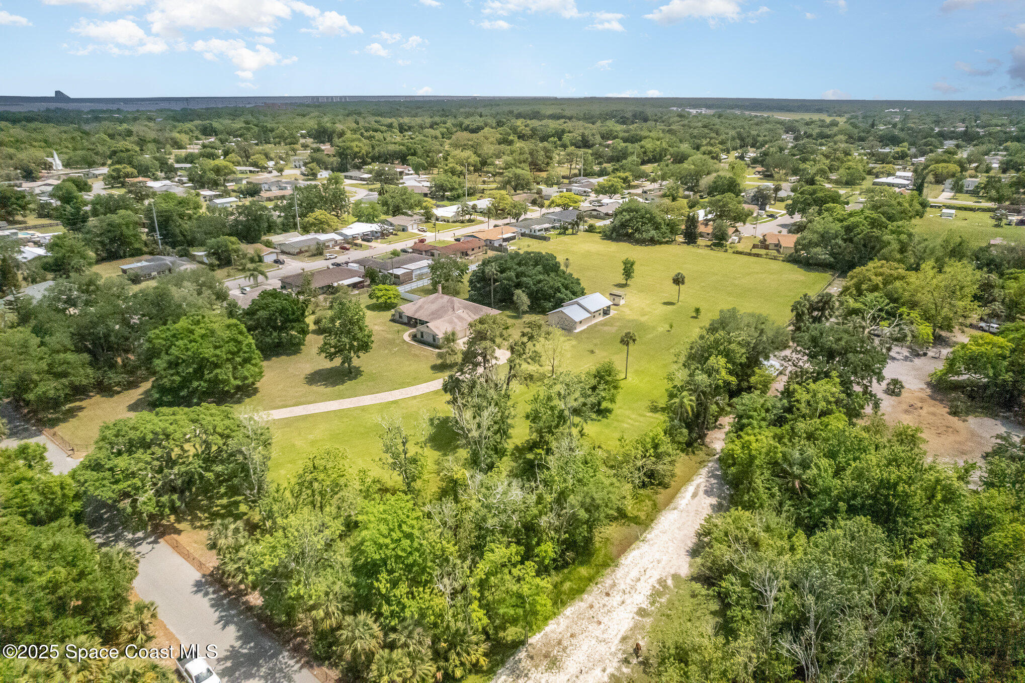 3105 Diamond Road Titusville, FL 32796 - Photo 59 of 81 an aerial view of residential houses with outdoor space and trees
