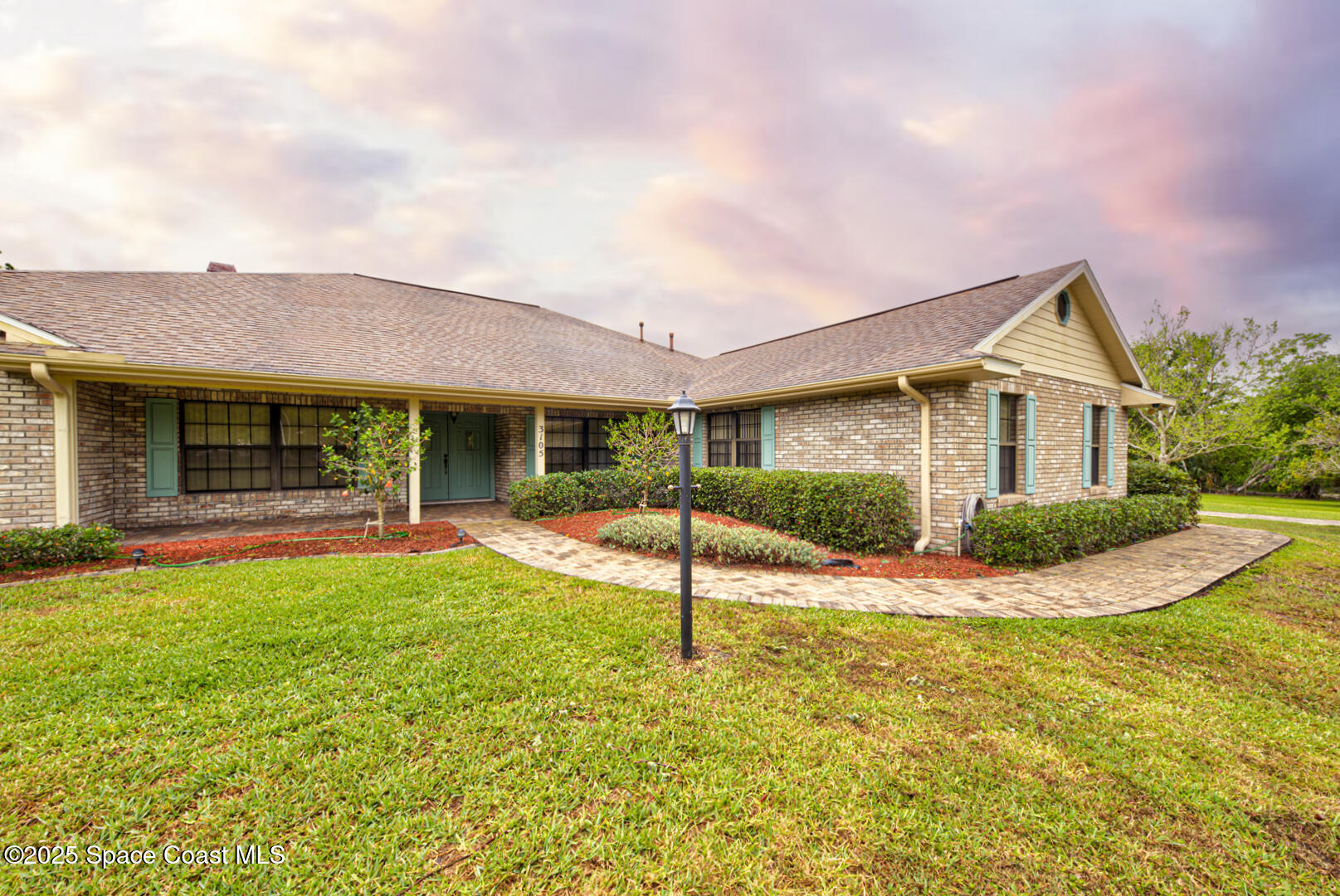 3105 Diamond Road Titusville, FL 32796 - Photo 7 of 81 a view of a house with a big yard and large tree