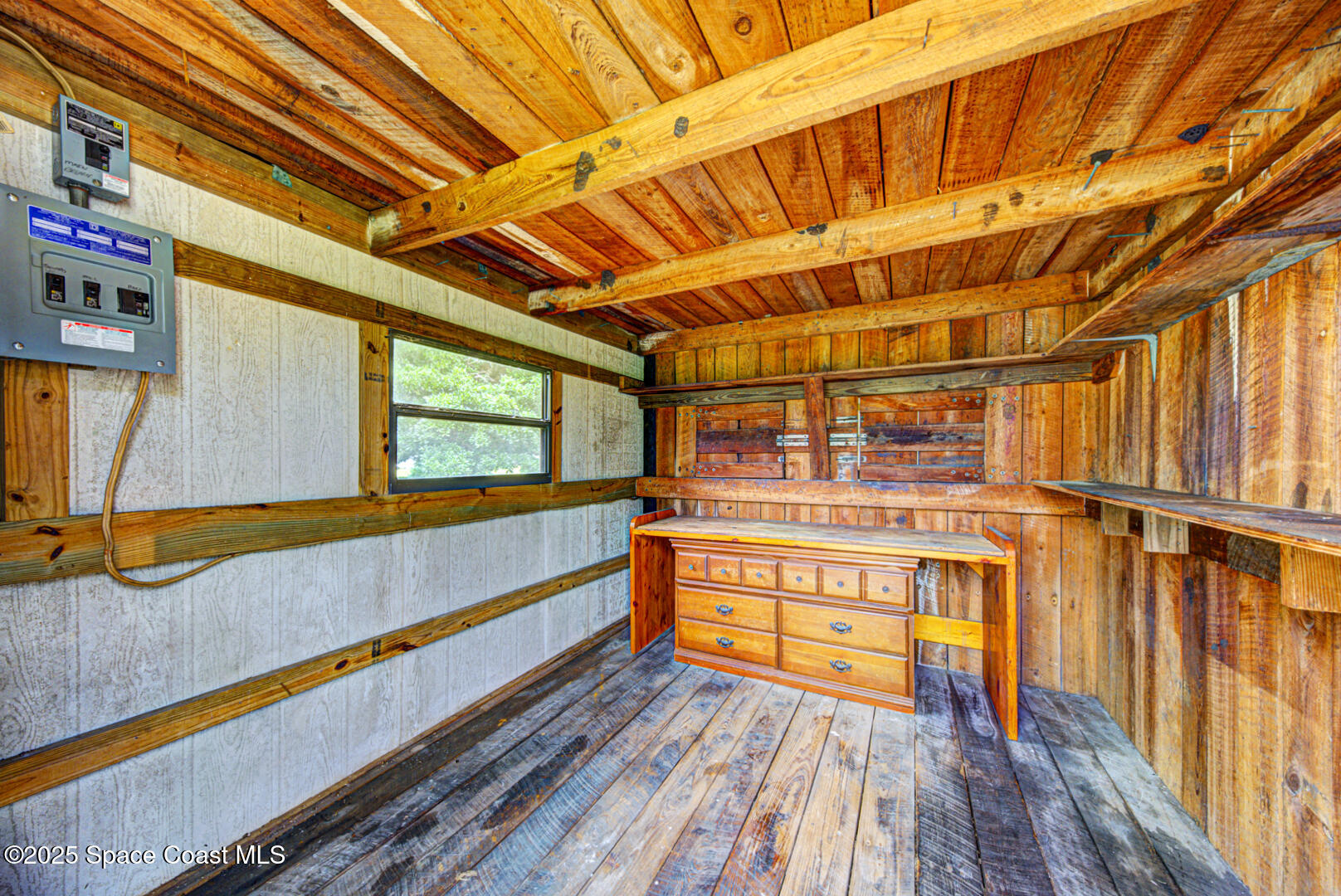 3105 Diamond Road Titusville, FL 32796 - Photo 72 of 81 a view of walk in closet with wooden floor