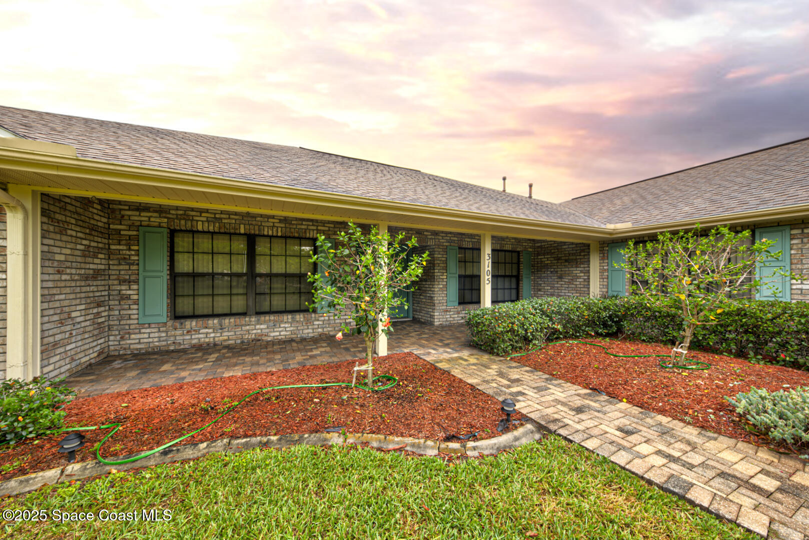 3105 Diamond Road Titusville, FL 32796 - Photo 8 of 81 a front view of a house with a yard and potted plants