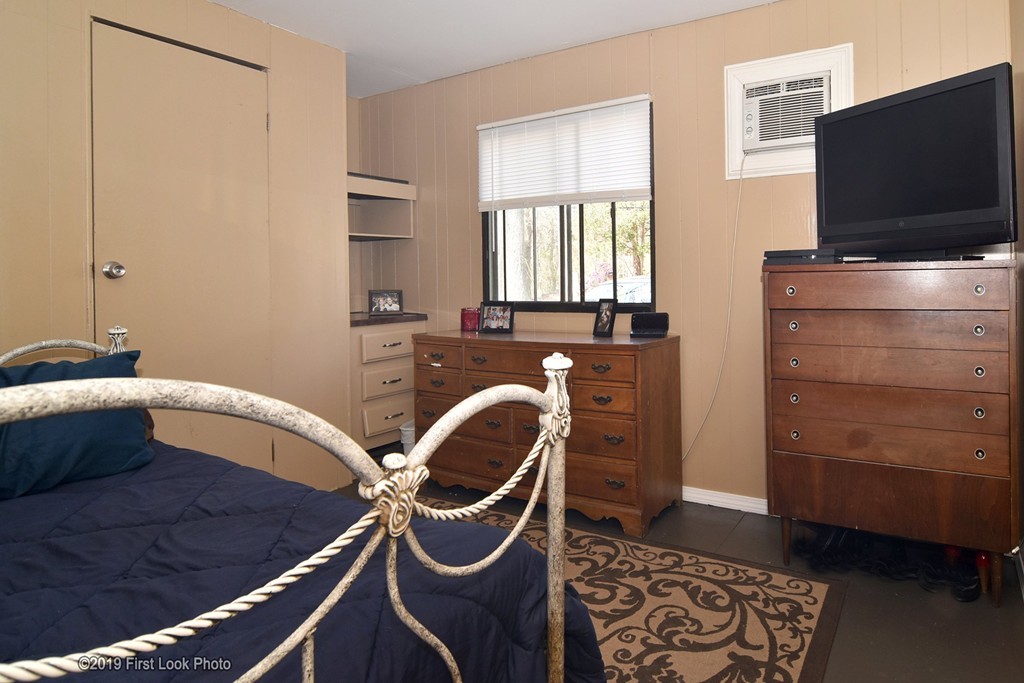 301 Bulgarmarsh Road, Unit F7 Tiverton, RI 02878 - Photo 19 of 30 a bedroom with a bed and furniture