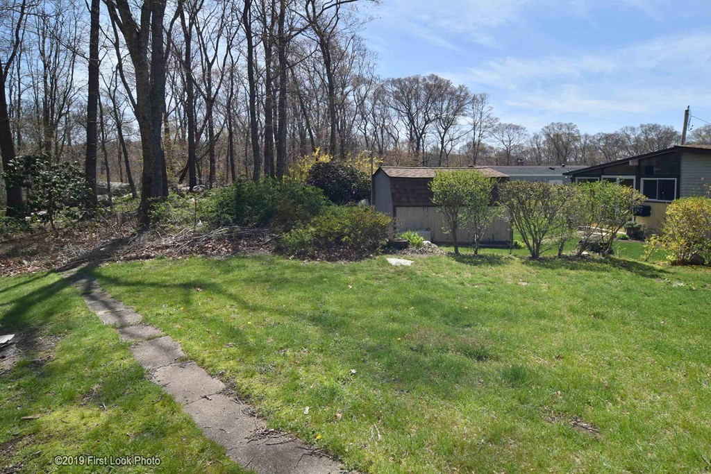 301 Bulgarmarsh Road, Unit F7 Tiverton, RI 02878 - Photo 24 of 30 a huge green field with lots of bushes