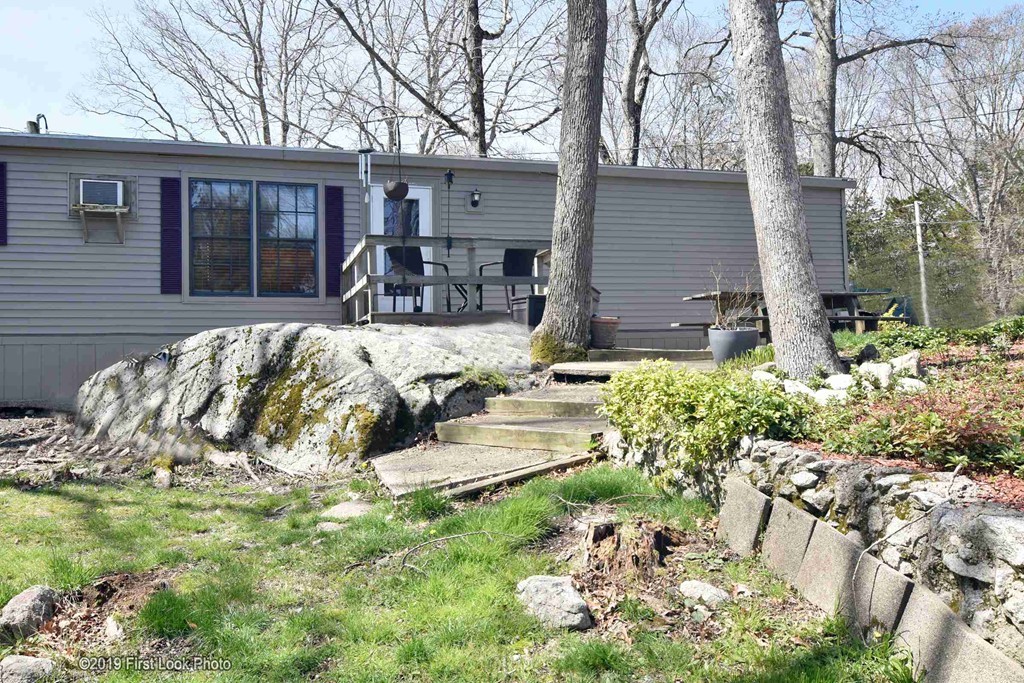 301 Bulgarmarsh Road, Unit F7 Tiverton, RI 02878 - Photo 3 of 30 a view of a house with yard and sitting area