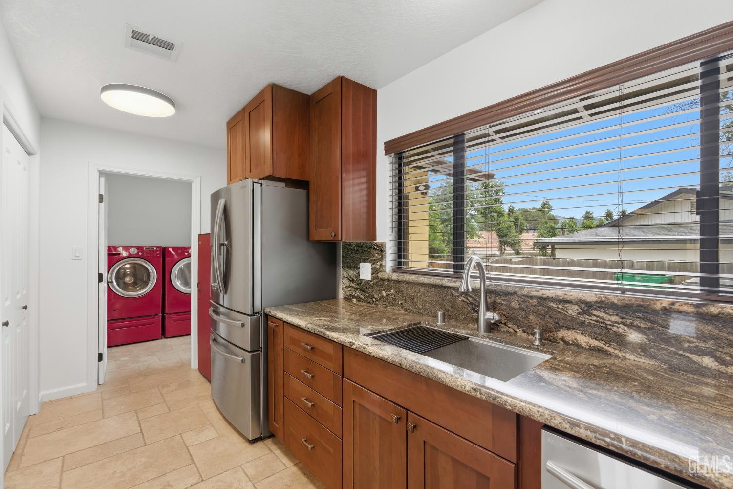 Undisclosed Address Springville, CA 93265 - Photo 19 of 62 a kitchen with stainless steel appliances granite countertop a refrigerator and a sink