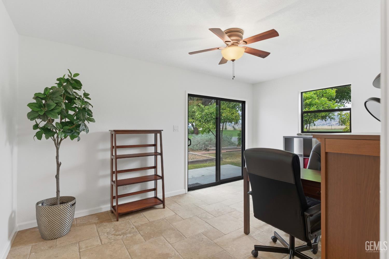 Undisclosed Address Springville, CA 93265 - Photo 31 of 62 a work room with furniture and a potted plant