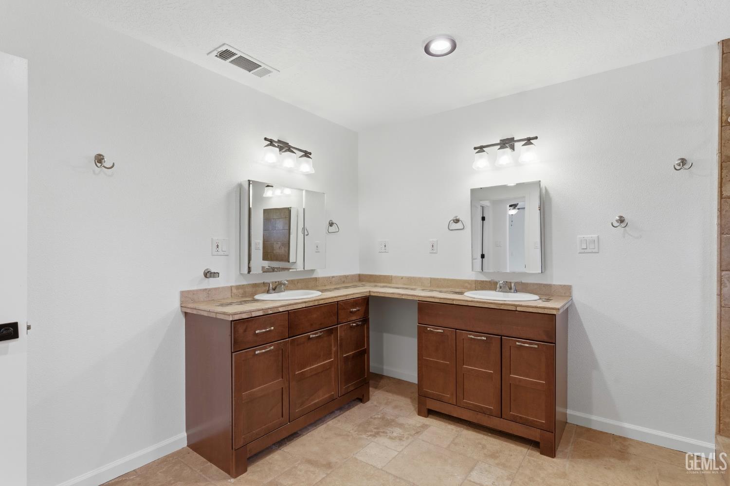 Undisclosed Address Springville, CA 93265 - Photo 34 of 62 a spacious bathroom with a granite countertop sink a mirror and a