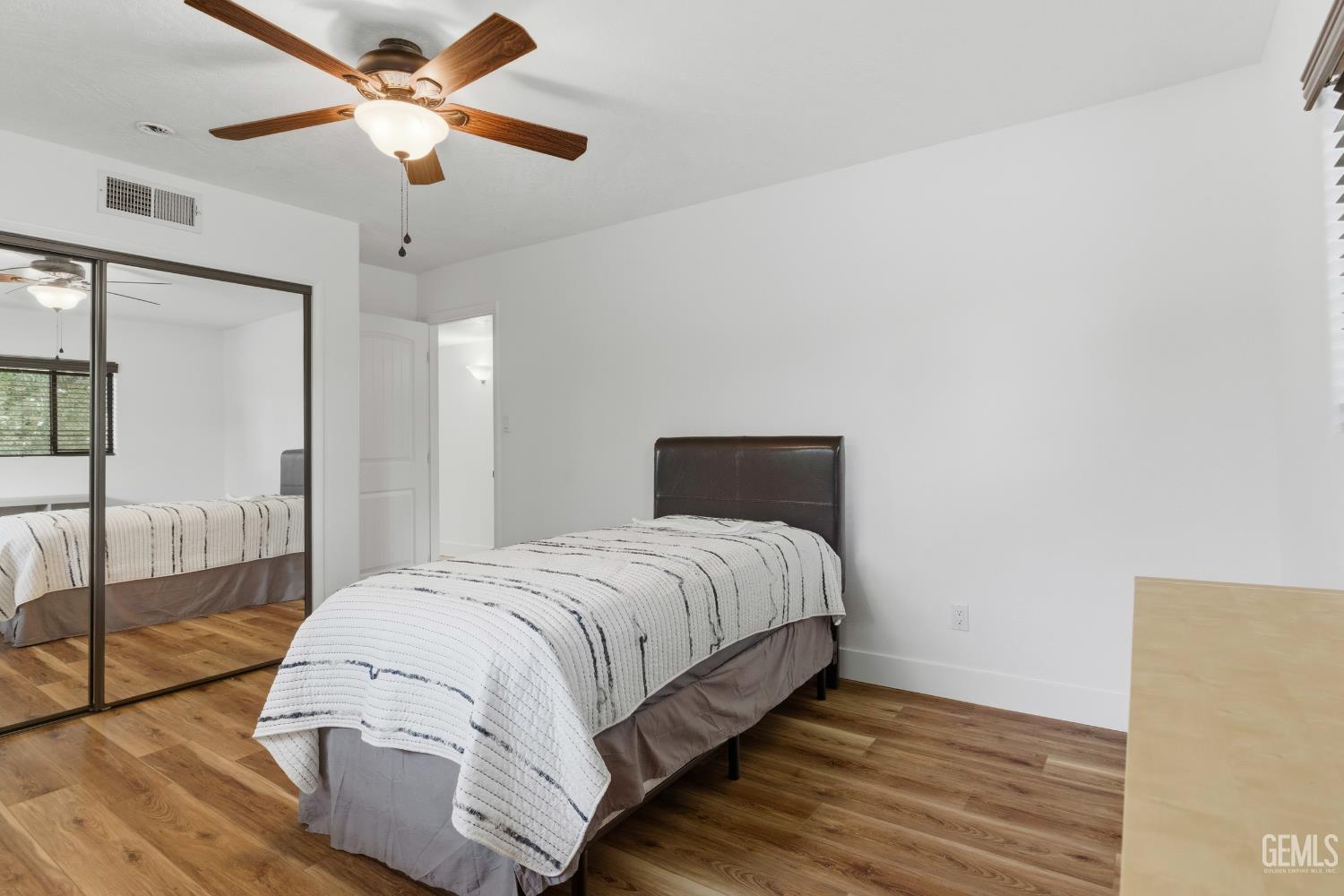 Undisclosed Address Springville, CA 93265 - Photo 37 of 62 a bedroom with a large bed and a chandelier