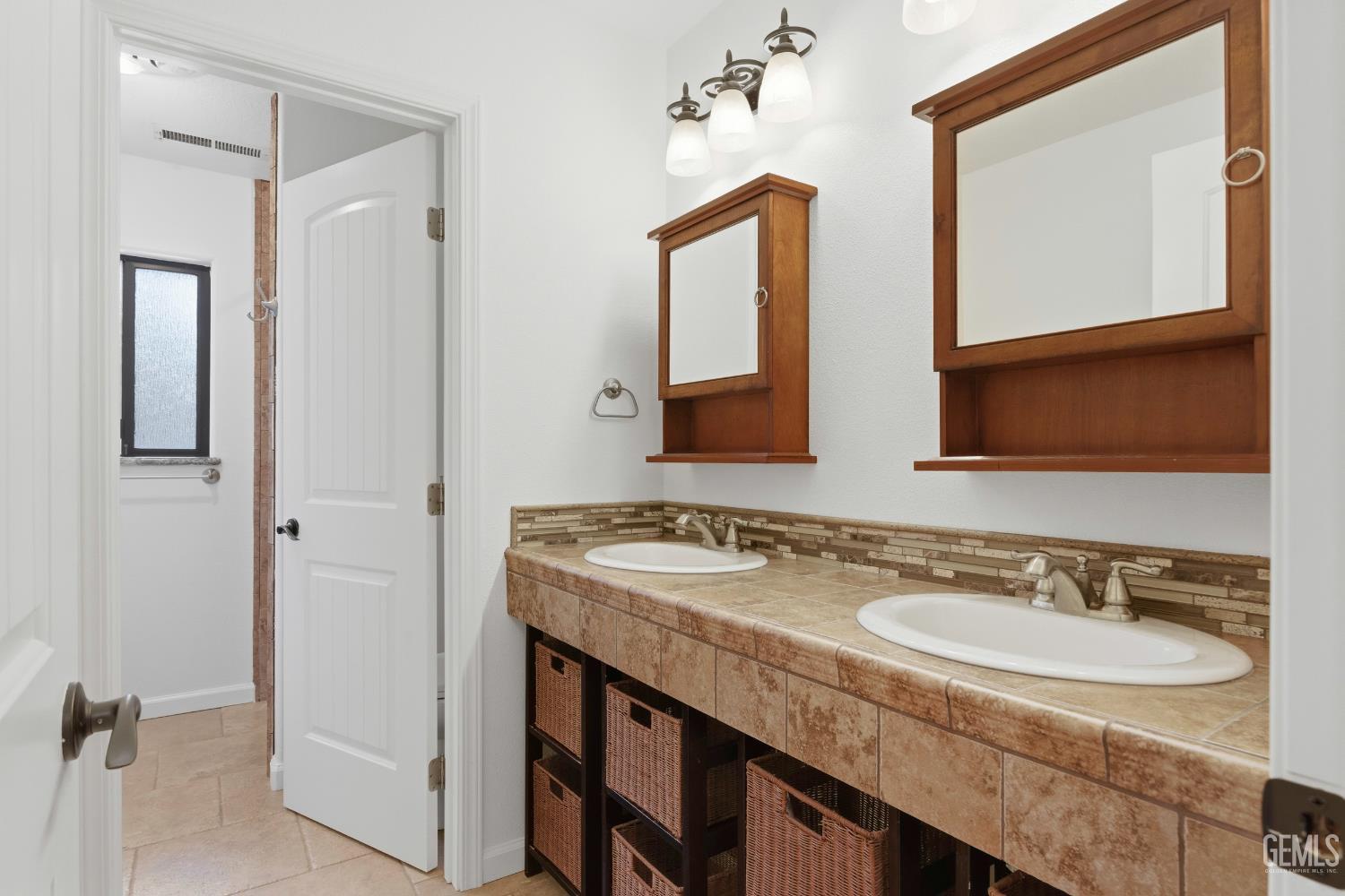 Undisclosed Address Springville, CA 93265 - Photo 38 of 62 a bathroom with a granite countertop sink and a mirror