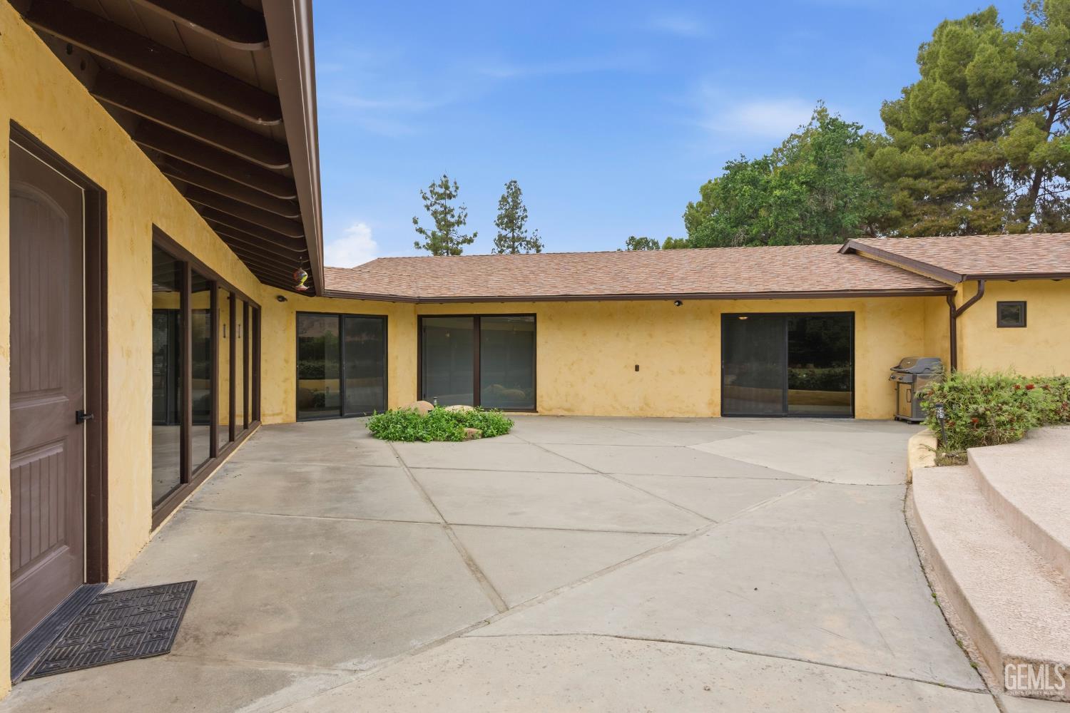 Undisclosed Address Springville, CA 93265 - Photo 45 of 62 a front view of a house with a yard and garage