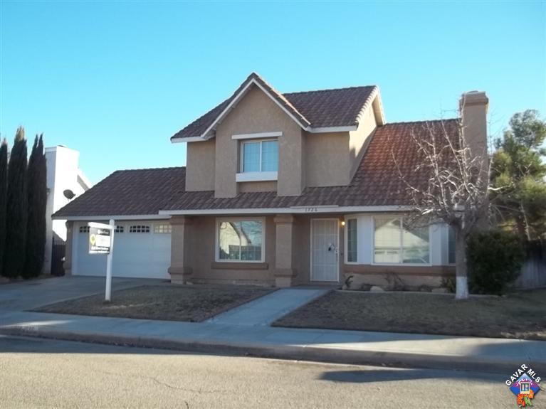 1726 East Ave R12 Palmdale, CA 93550 - Photo 1 of 12 a front view of house with yard