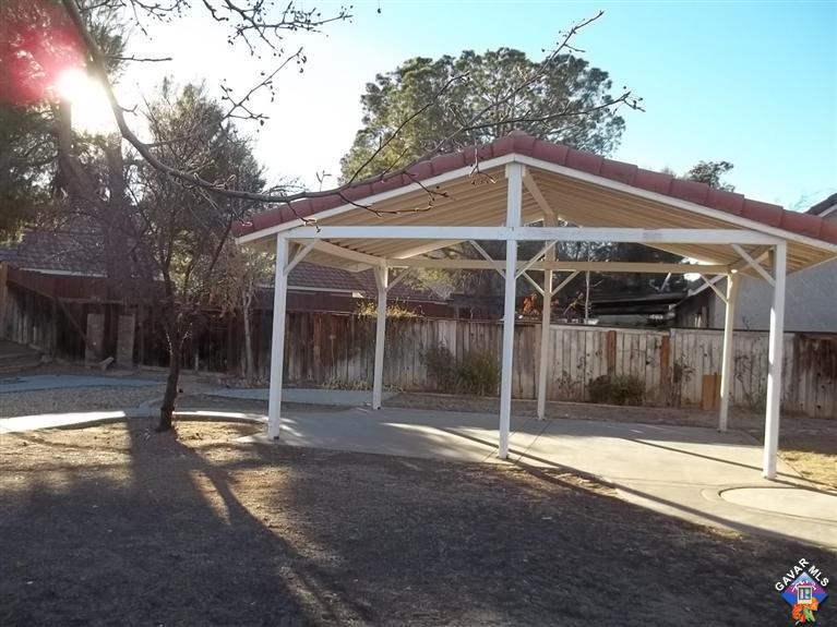1726 East Ave R12 Palmdale, CA 93550 - Photo 11 of 12 a view of a entrance gate of the house