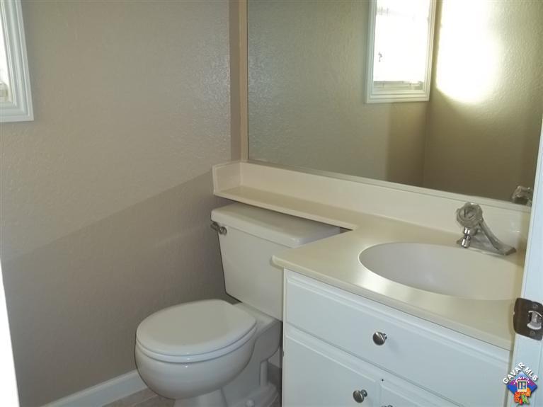 1726 East Ave R12 Palmdale, CA 93550 - Photo 5 of 12 a bathroom with a sink and a toilet