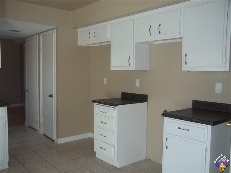 1726 East Ave R12 Palmdale, CA 93550 - Photo 7 of 12 a kitchen with cabinets and window