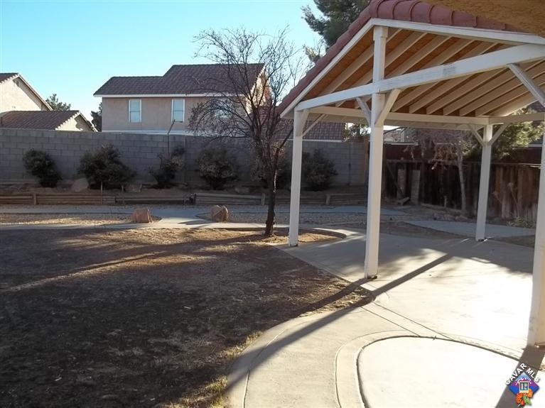 1726 East Ave R12 Palmdale, CA 93550 - Photo 10 of 12 a view of a house with a yard