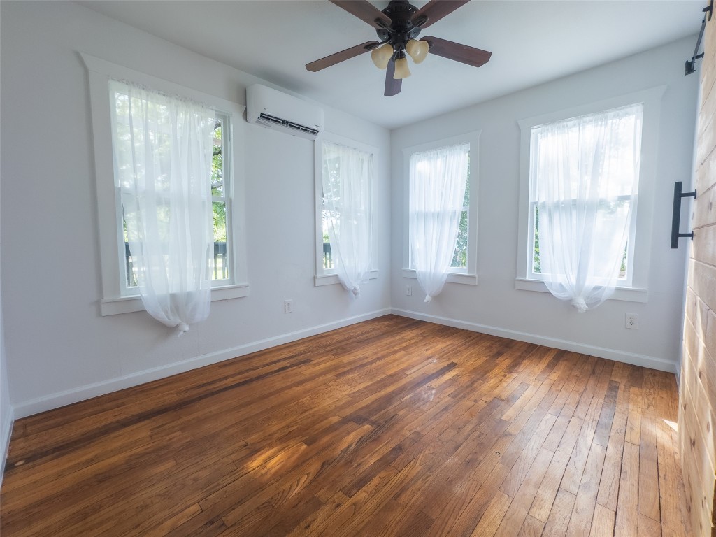 1148 Gunter Street Austin, TX 78721 - Photo 29 of 38 a view of empty room with wooden floor and fan
