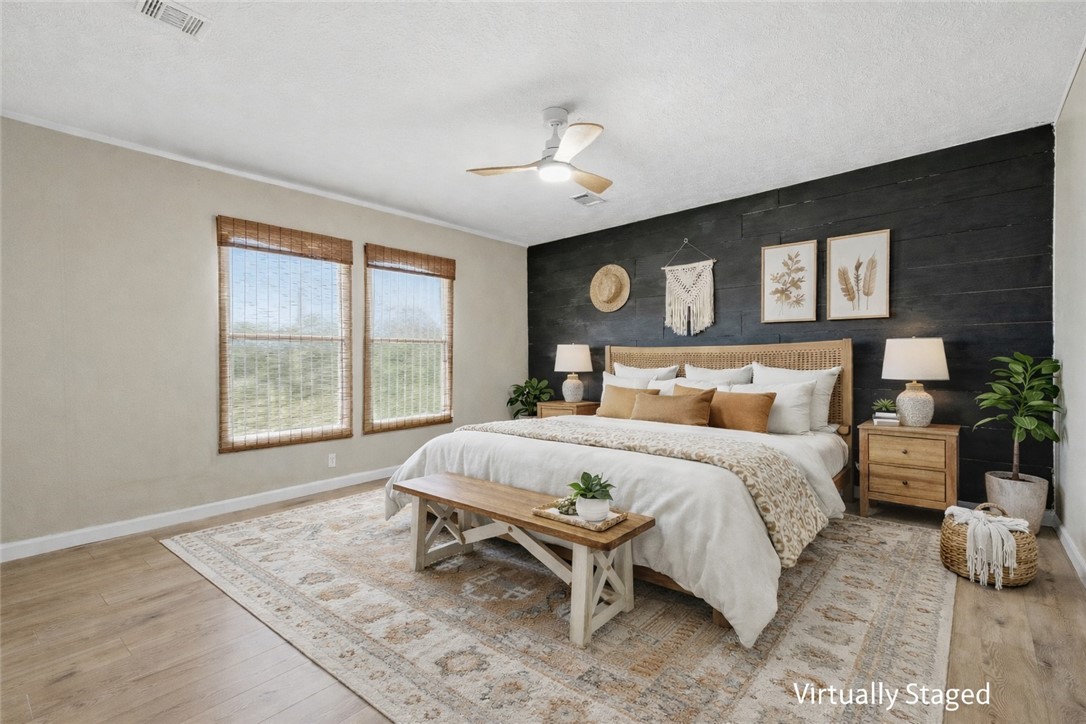 124 County Road 632 Sinton, TX 78387 - Photo 19 of 40 a bed room with a bed and a window