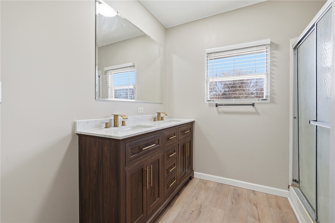 124 County Road 632 Sinton, TX 78387 - Photo 24 of 40 a bathroom with a sink vanity and a mirror