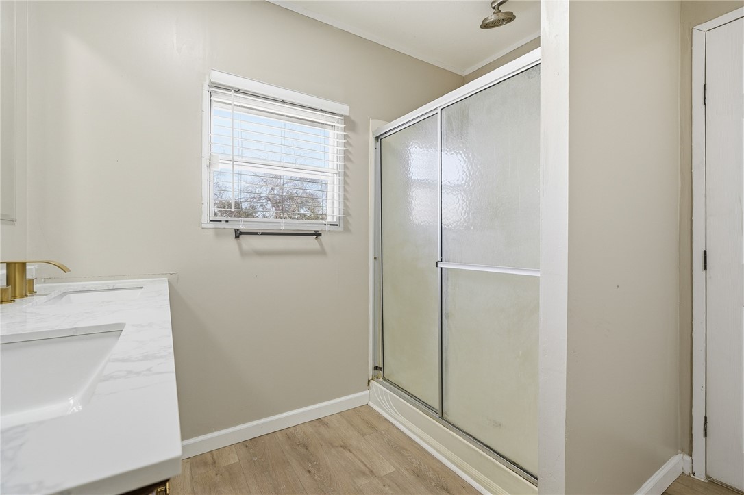 124 County Road 632 Sinton, TX 78387 - Photo 25 of 40 a view of bathroom with a sink cabinet and mirror