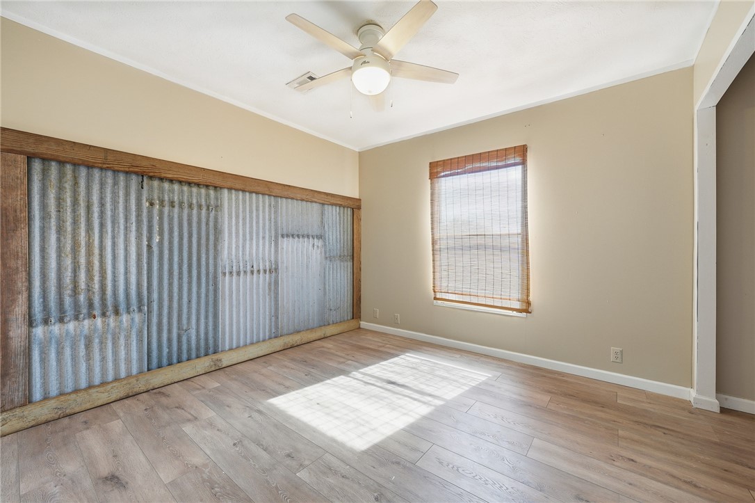 124 County Road 632 Sinton, TX 78387 - Photo 26 of 40 a view of an empty room with window and wooden floor