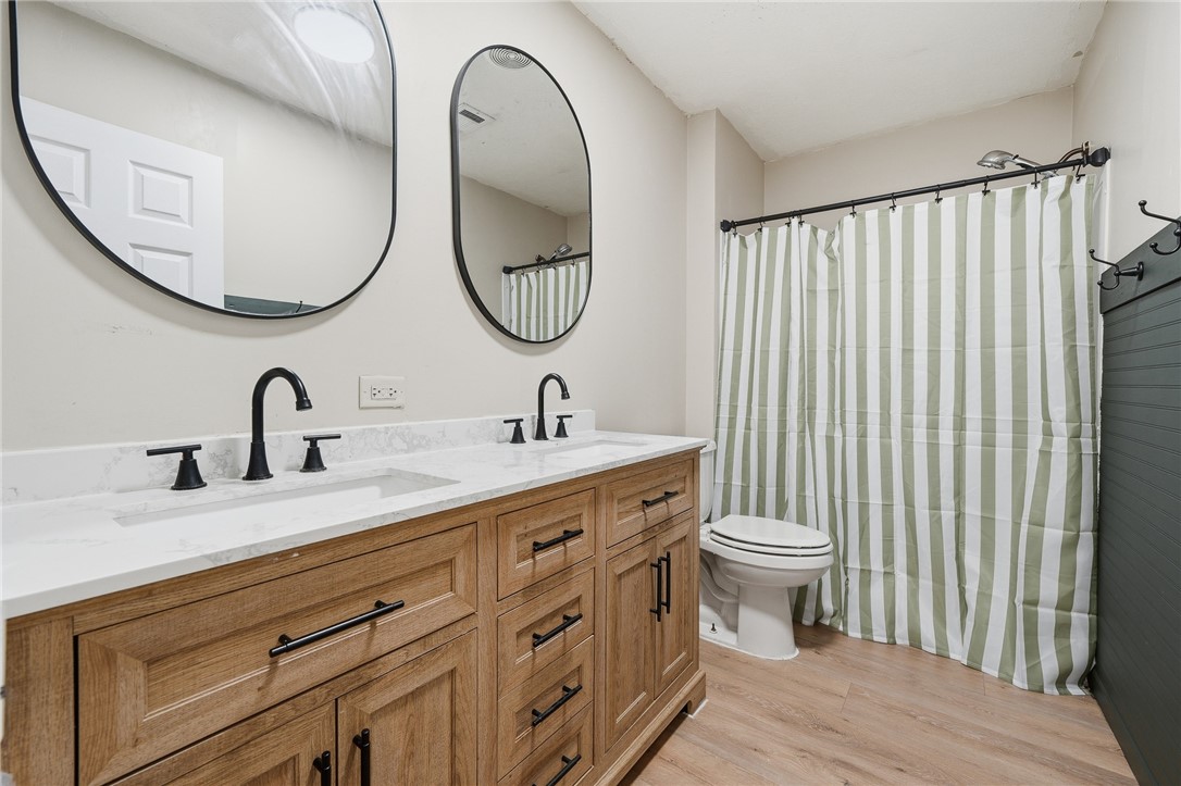 124 County Road 632 Sinton, TX 78387 - Photo 28 of 40 a bathroom with a double vanity sink and a mirror
