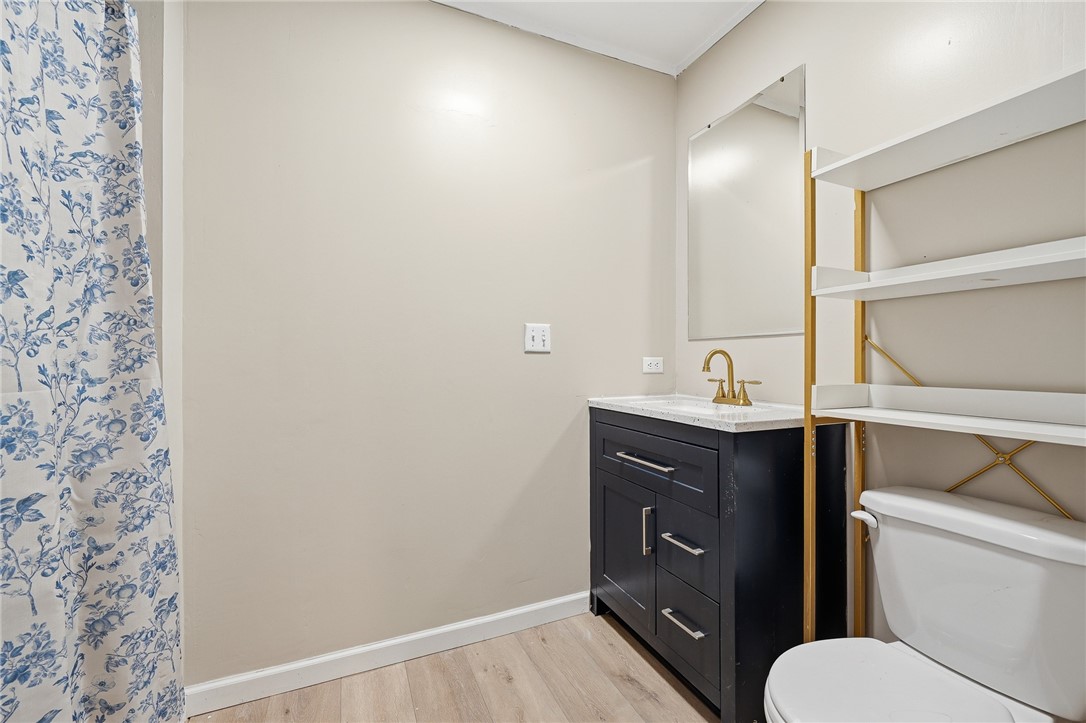 124 County Road 632 Sinton, TX 78387 - Photo 31 of 40 a bathroom with a toilet a sink and mirror