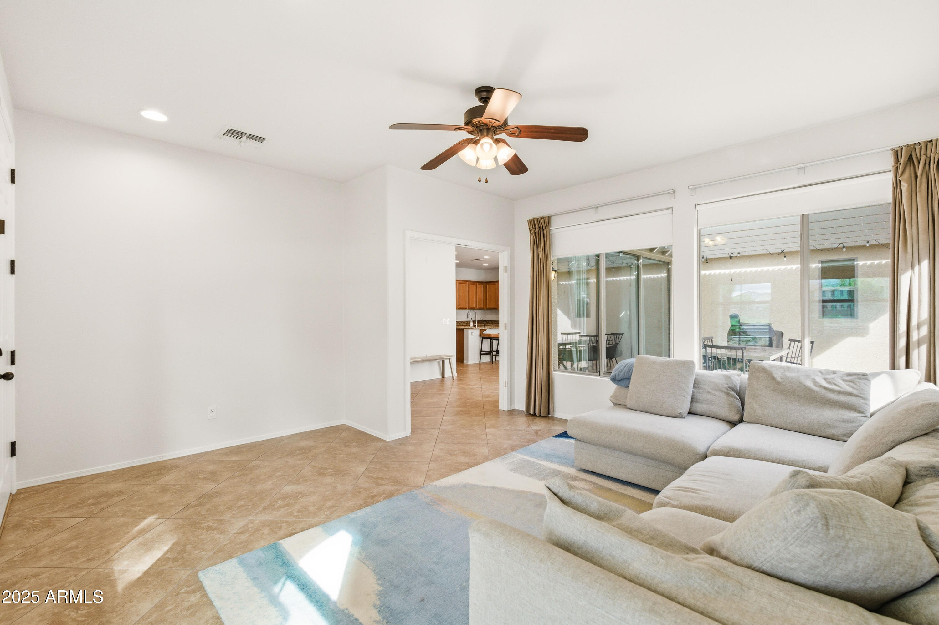 4495 East Woodside Way Gilbert, AZ 85297 - Photo 13 of 80 a living room with furniture and a large window