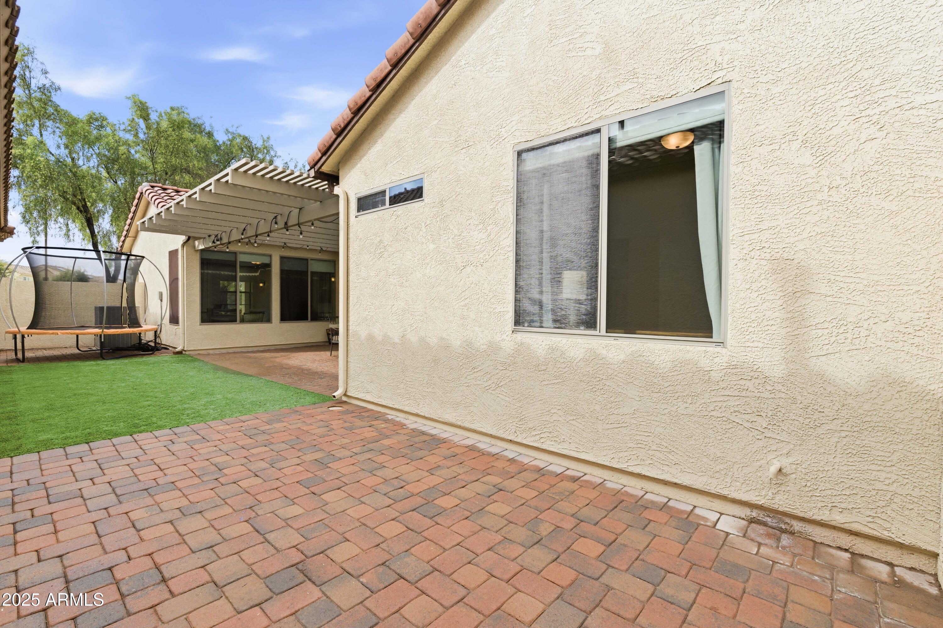 4495 East Woodside Way Gilbert, AZ 85297 - Photo 39 of 80 a front view of a house with a yard and a garage