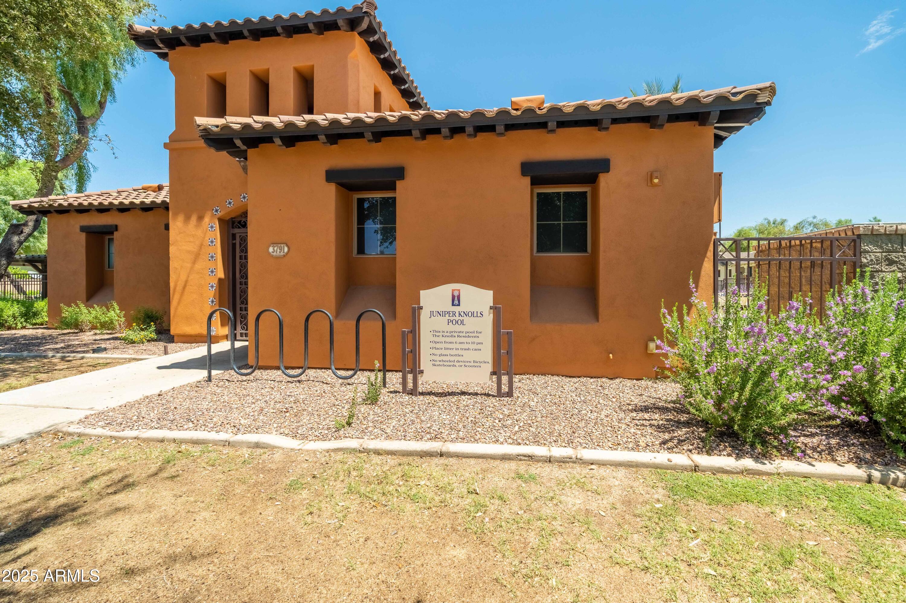 4495 East Woodside Way Gilbert, AZ 85297 - Photo 50 of 80 a front view of a house with a yard