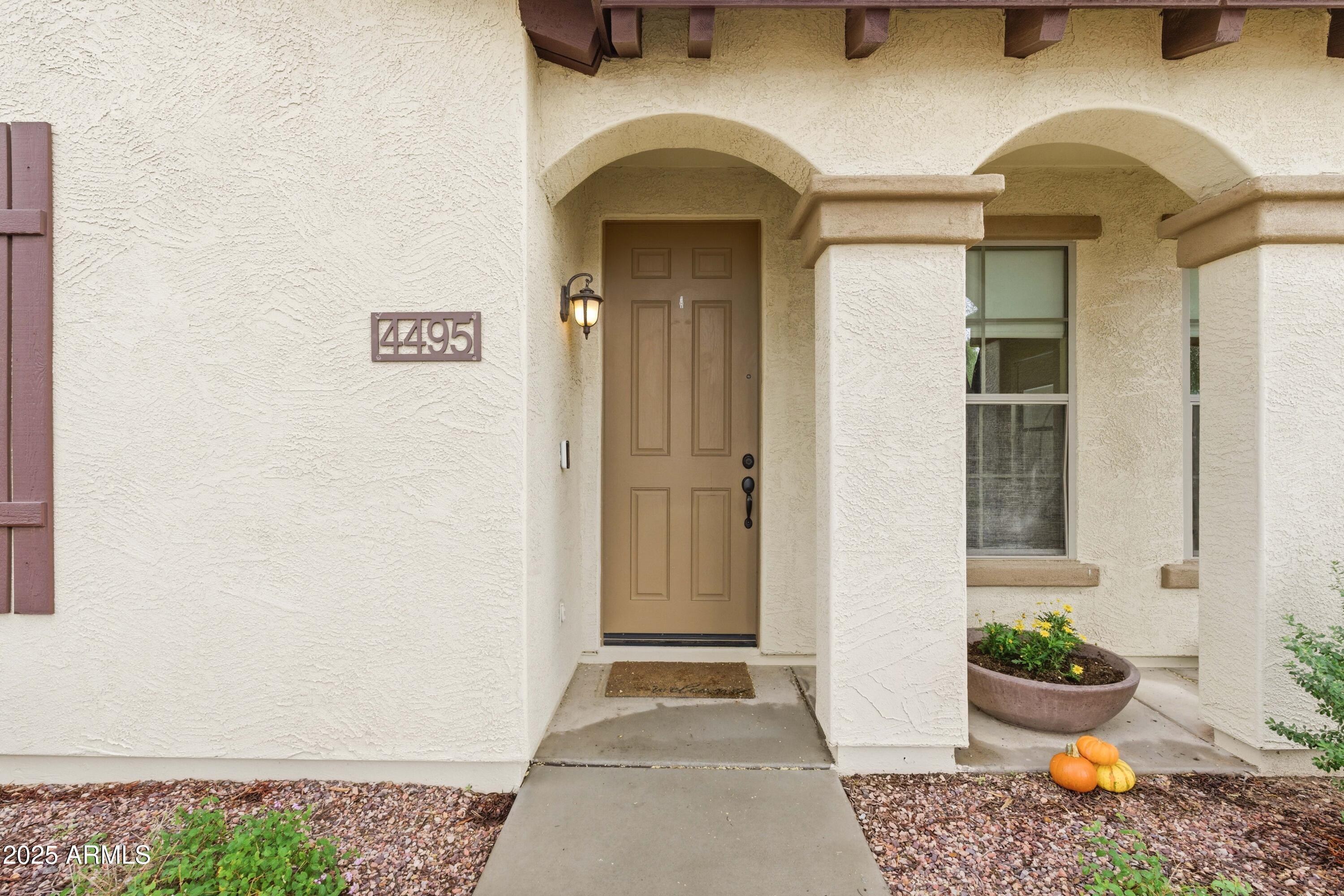 4495 East Woodside Way Gilbert, AZ 85297 - Photo 8 of 80 a view of an entryway door front of house