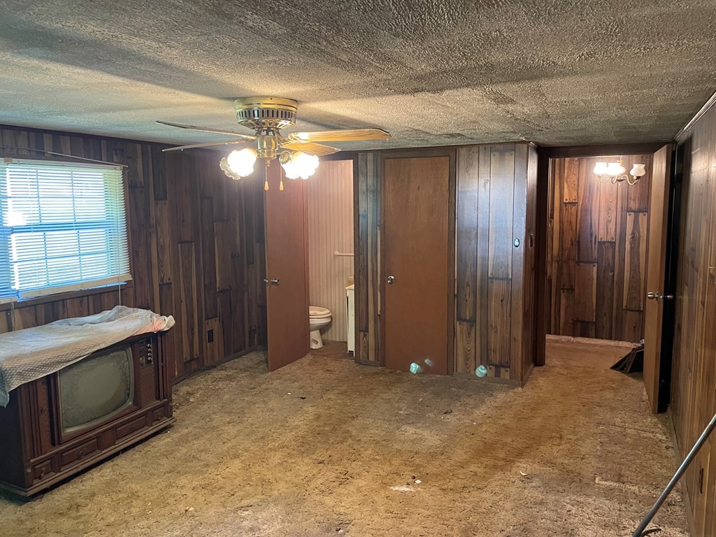 3149 Mutton Hollow Road Kodak, TN 37764 - Photo 12 of 16 a view of an empty room with window and chandelier fan