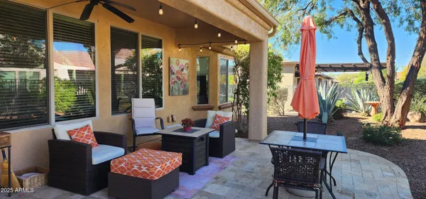 a outdoor living space with furniture and a potted plant