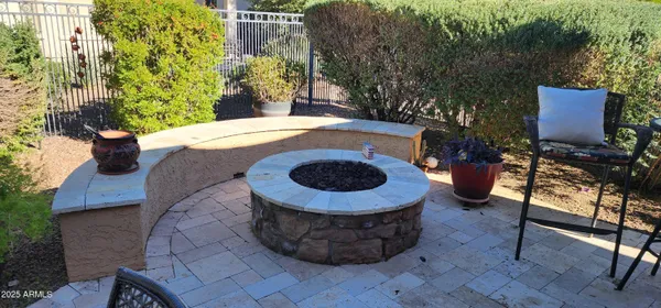 a view of a grassy field with an ocean