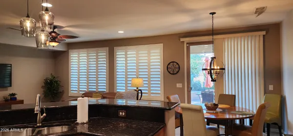 a view of a dining room with furniture window and outside view