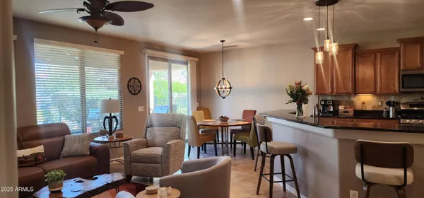 a view of a dining room with furniture window and outside view
