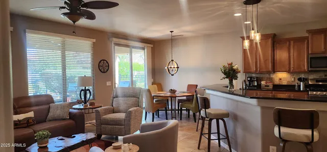 a view of a dining room with furniture window and outside view