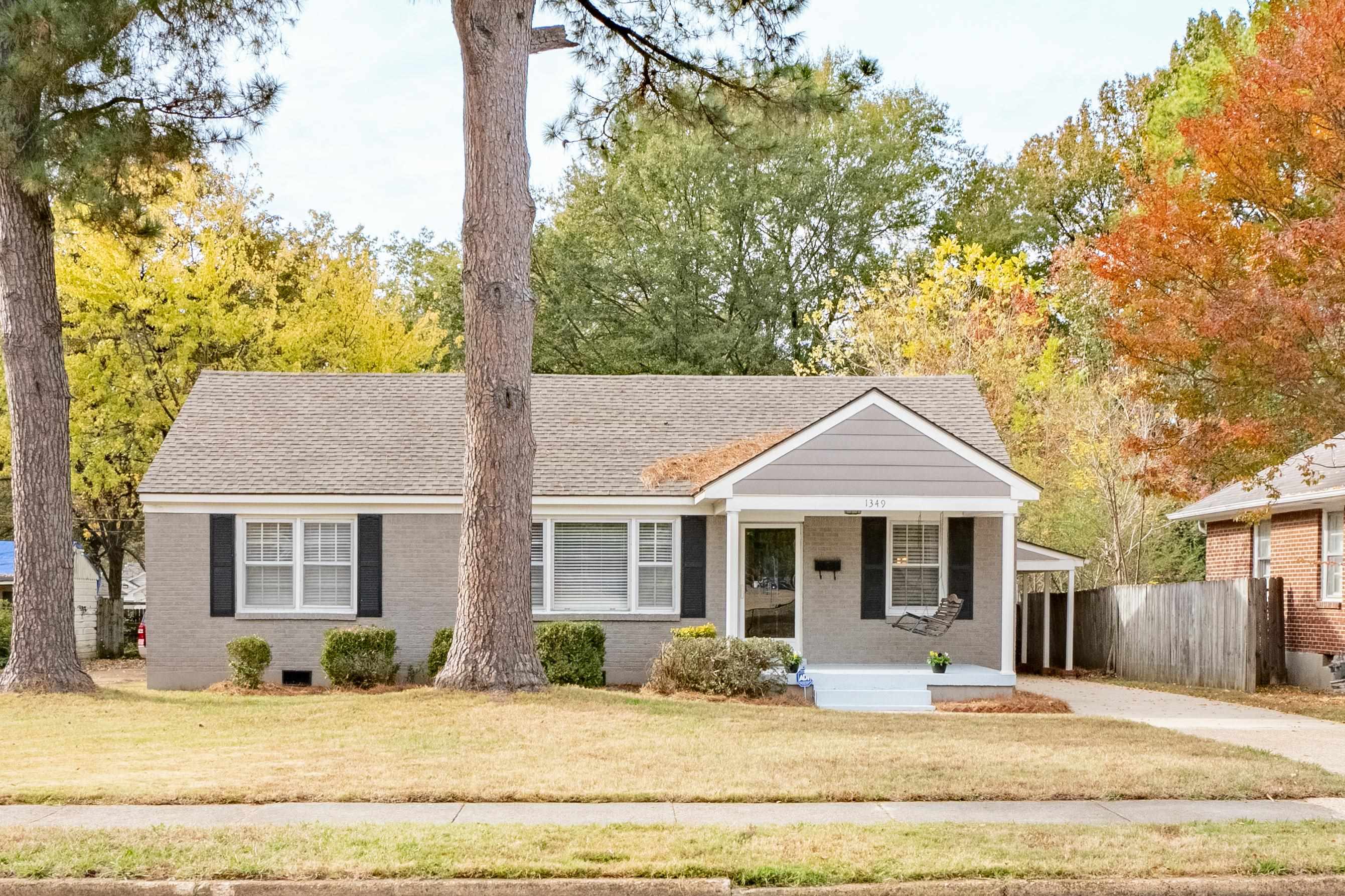 1349 Colonial Road Memphis, TN 38117 - Photo 1 of 29 a front view of a house with a yard