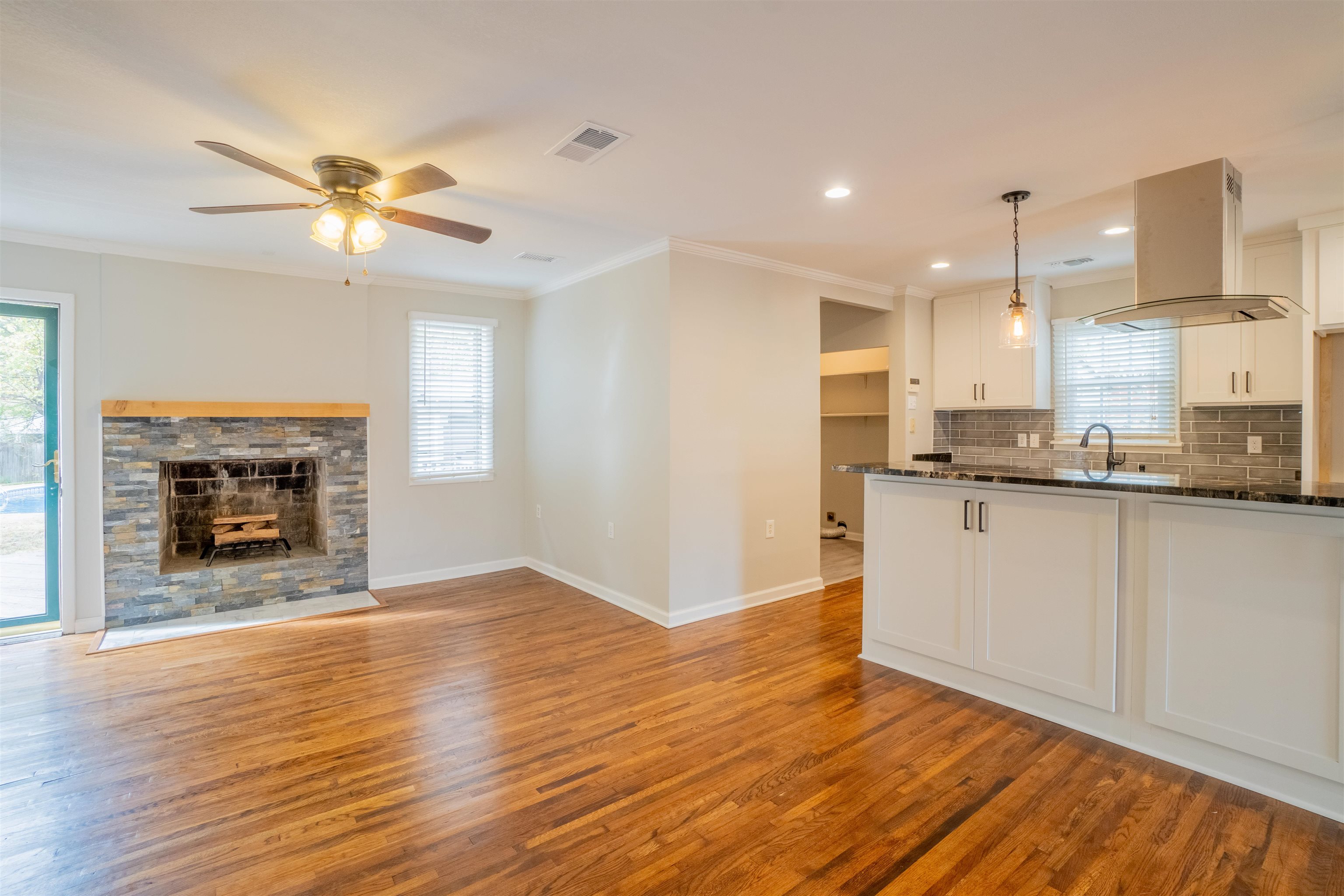 1349 Colonial Road Memphis, TN 38117 - Photo 11 of 29 a view of kitchen with granite countertop cabinets and a fireplace