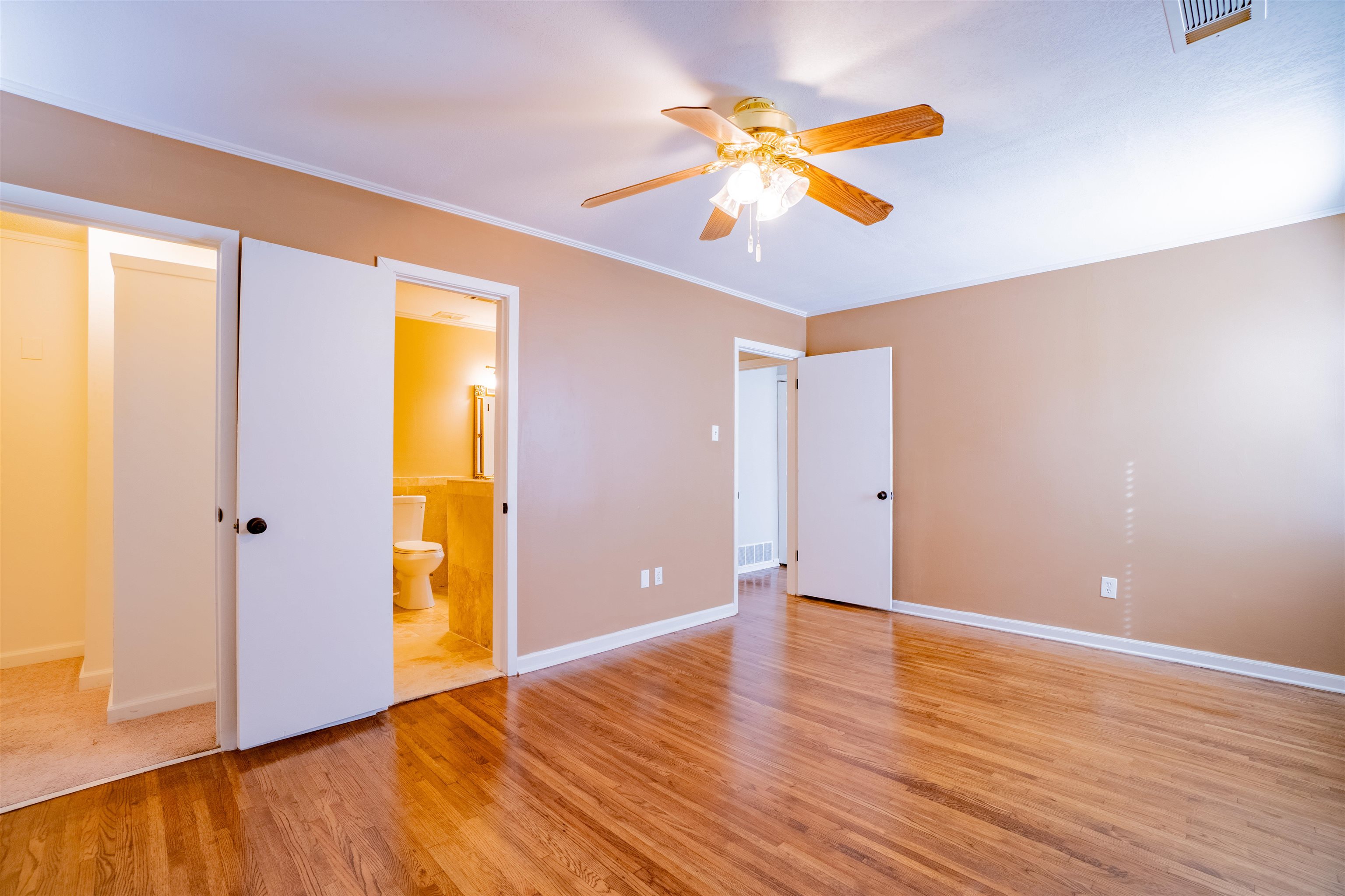 1349 Colonial Road Memphis, TN 38117 - Photo 13 of 29 a view of an empty room with wooden floor and a window