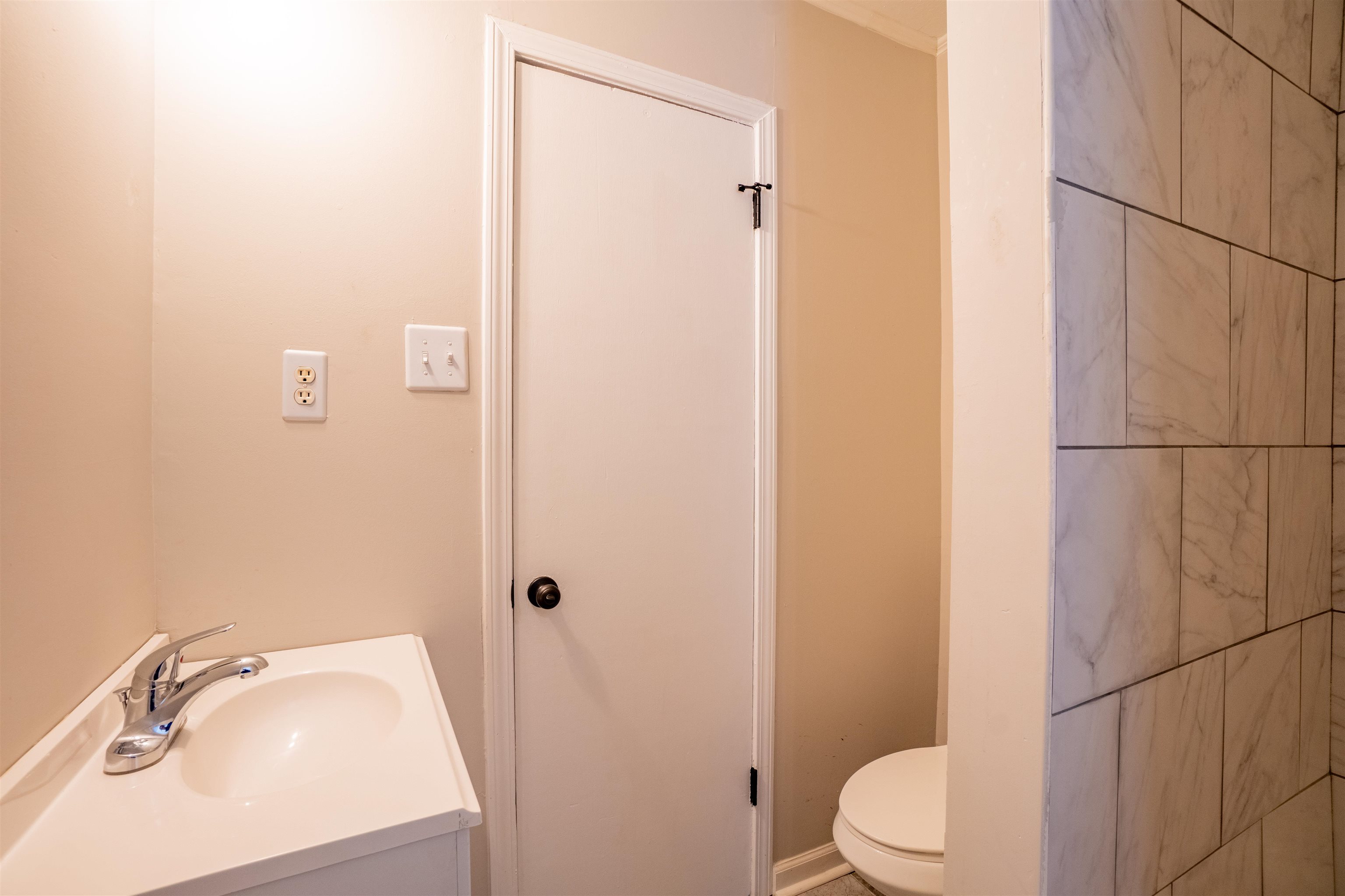 1349 Colonial Road Memphis, TN 38117 - Photo 19 of 29 a bathroom with a sink a toilet and shower