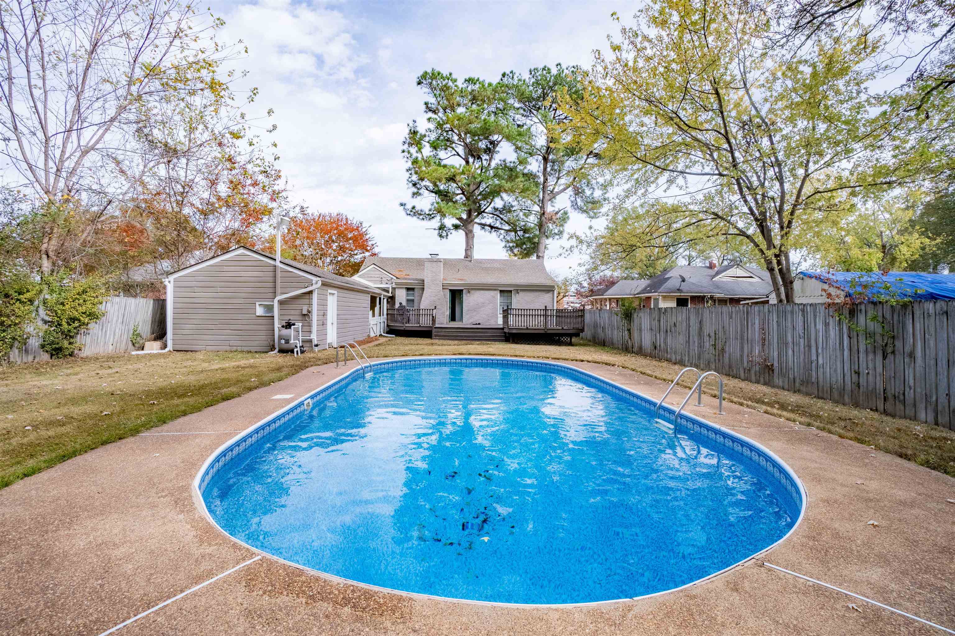 1349 Colonial Road Memphis, TN 38117 - Photo 2 of 29 a view of a swimming pool with a patio